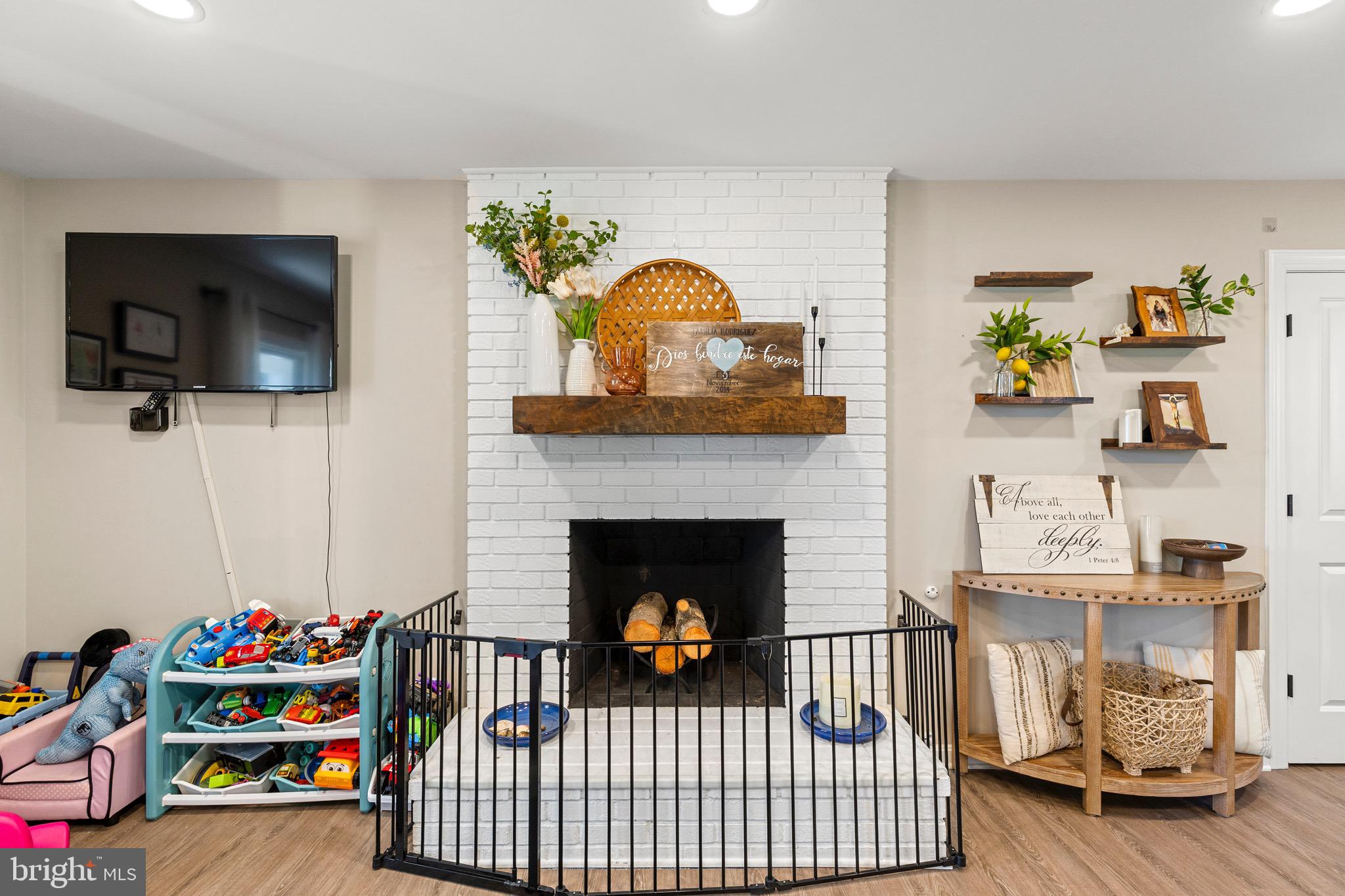 6666 Kelly Road Warrenton, VA 20187 - Photo 12 of 34 a living room with furniture and a fireplace