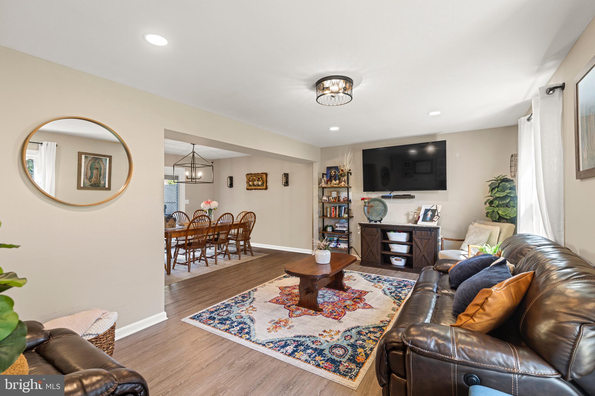 6666 Kelly Road Warrenton, VA 20187 - Photo 2 of 34 a living room with furniture and a flat screen tv