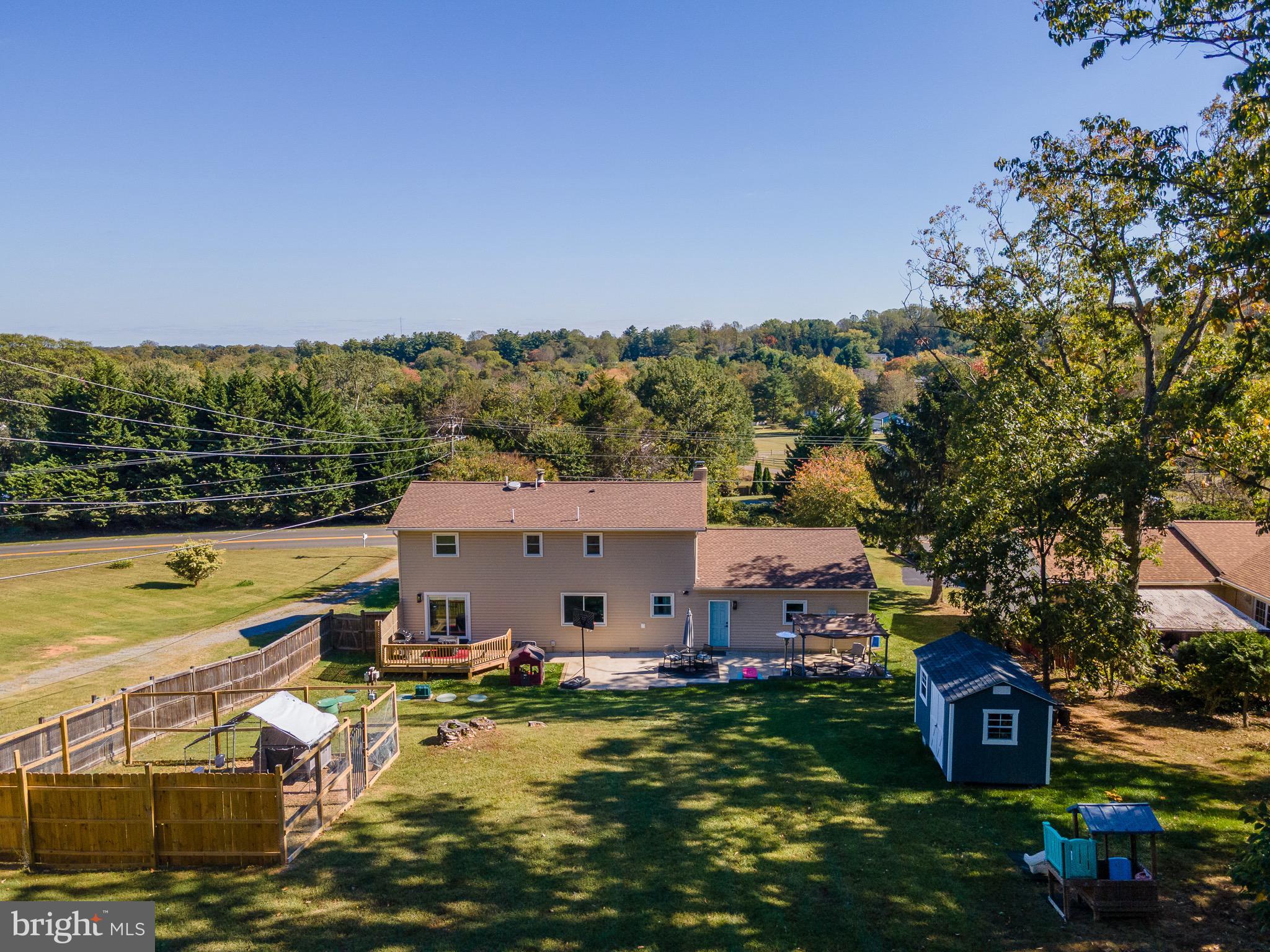 6666 Kelly Road Warrenton, VA 20187 - Photo 31 of 34 an aerial view of a house with a garden