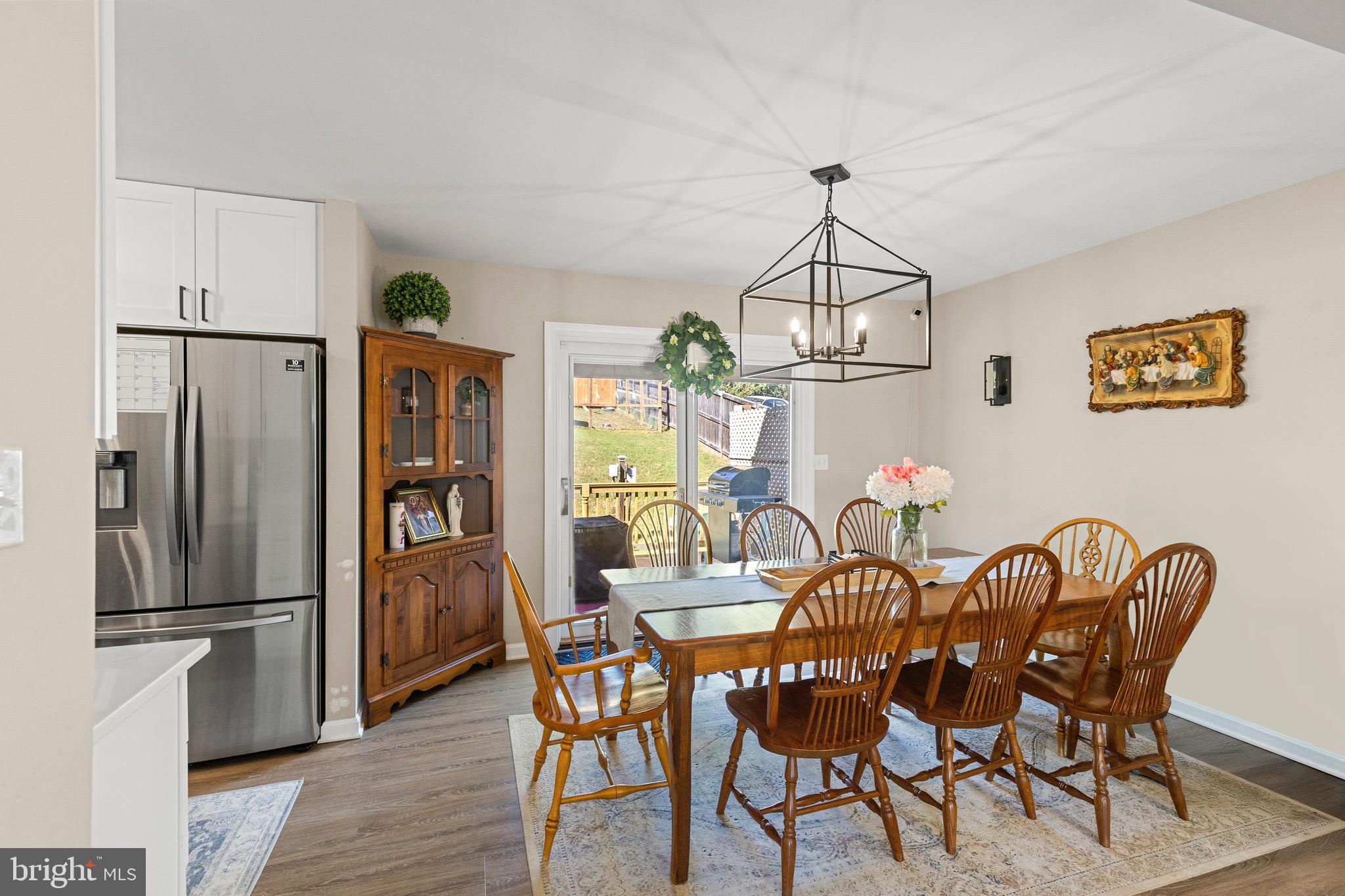 6666 Kelly Road Warrenton, VA 20187 - Photo 4 of 34 a view of a dining room with furniture window and wooden floor