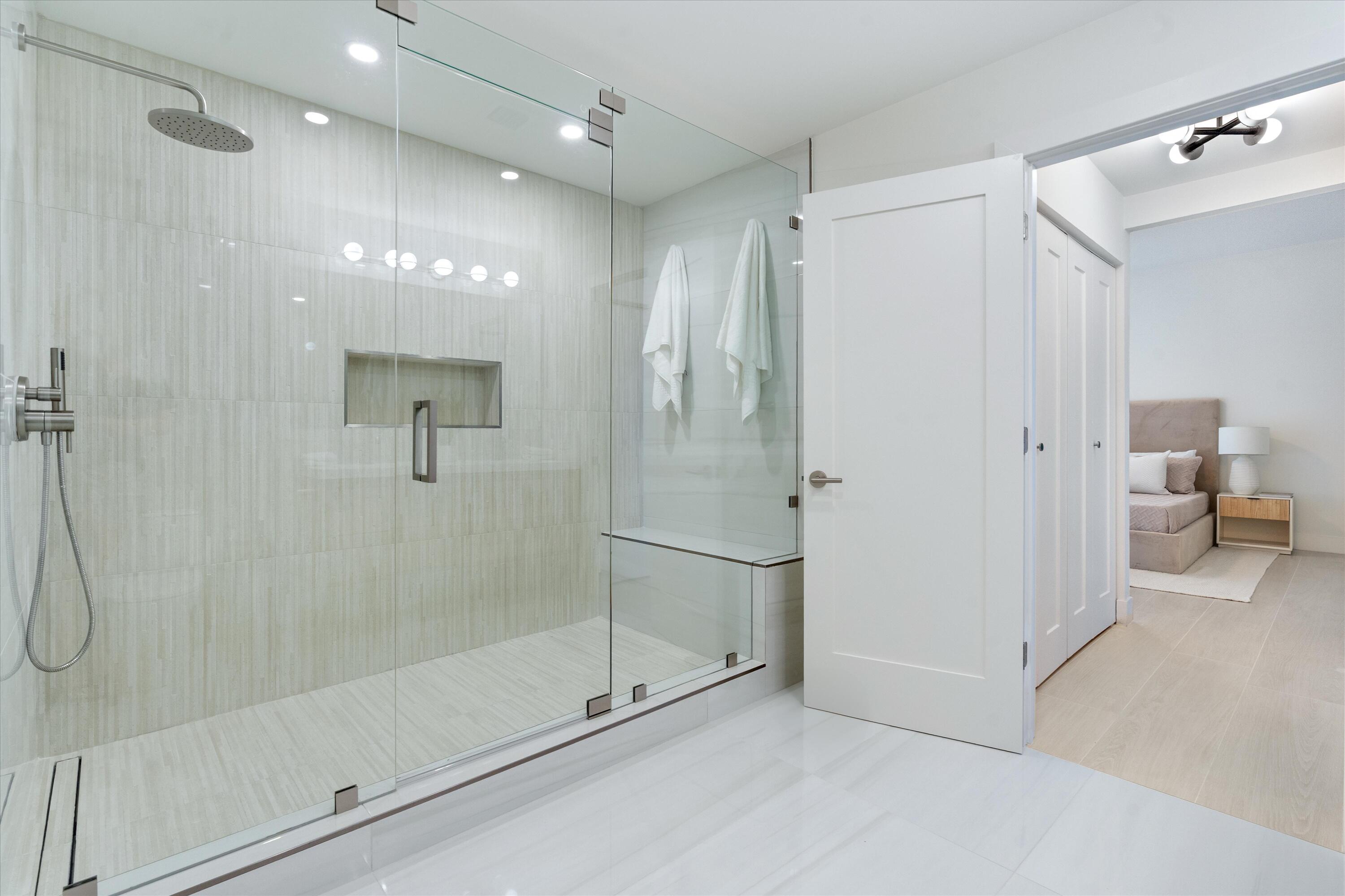 5154 Lake Catalina Drive, Unit A Boca Raton, FL 33496 - Photo 17 of 51 a bathroom with a shower and a glass door