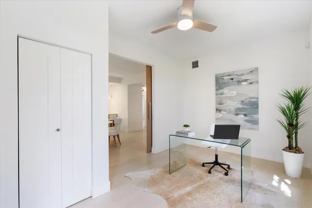 a workspace with furniture and a potted plant