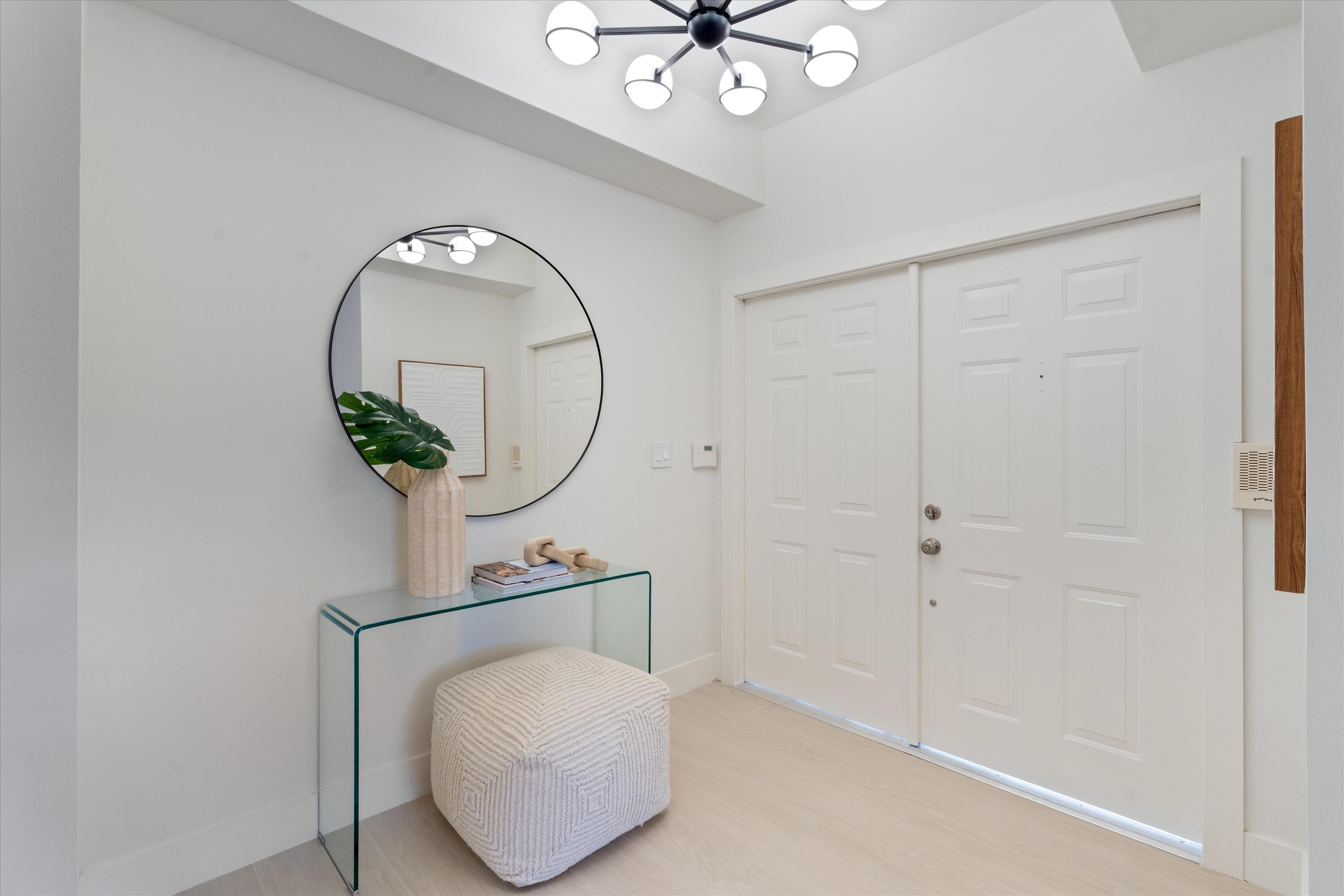 5154 Lake Catalina Drive, Unit A Boca Raton, FL 33496 - Photo 22 of 51 a bathroom with a sink and a mirror