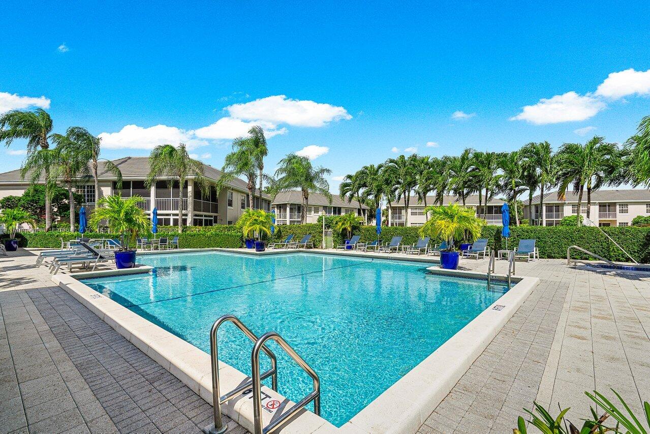 5154 Lake Catalina Drive, Unit A Boca Raton, FL 33496 - Photo 31 of 51 a view of swimming pool with outdoor seating and yard