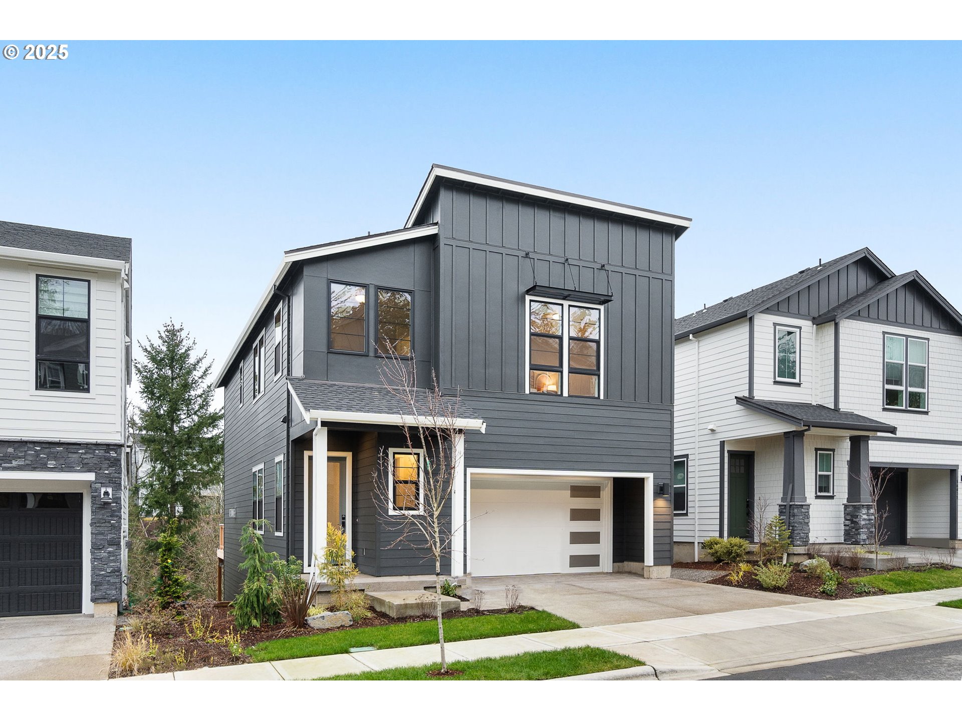 16089 Northwest Holman Way, Unit L 62 Portland, OR 97229 - Photo 1 of 26 a front view of house with yard