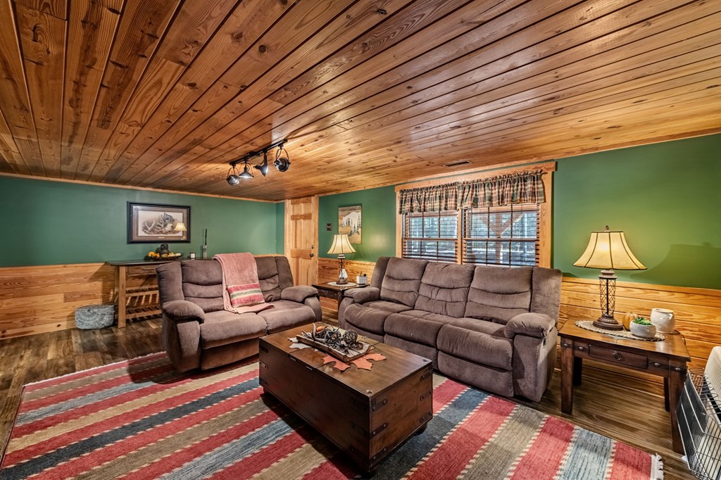 134 Ebenezer Road Ellijay, GA 30536 - Photo 19 of 85 a living room with furniture and a wooden floor