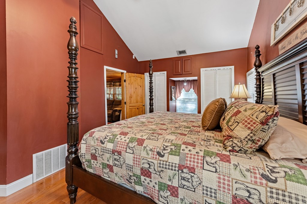 134 Ebenezer Road Ellijay, GA 30536 - Photo 31 of 85 a bedroom with a large bed and a closet