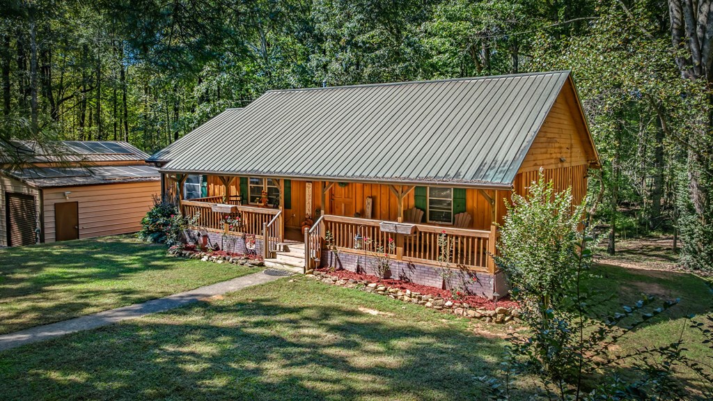 134 Ebenezer Road Ellijay, GA 30536 - Photo 9 of 85 a front view of a house with garden