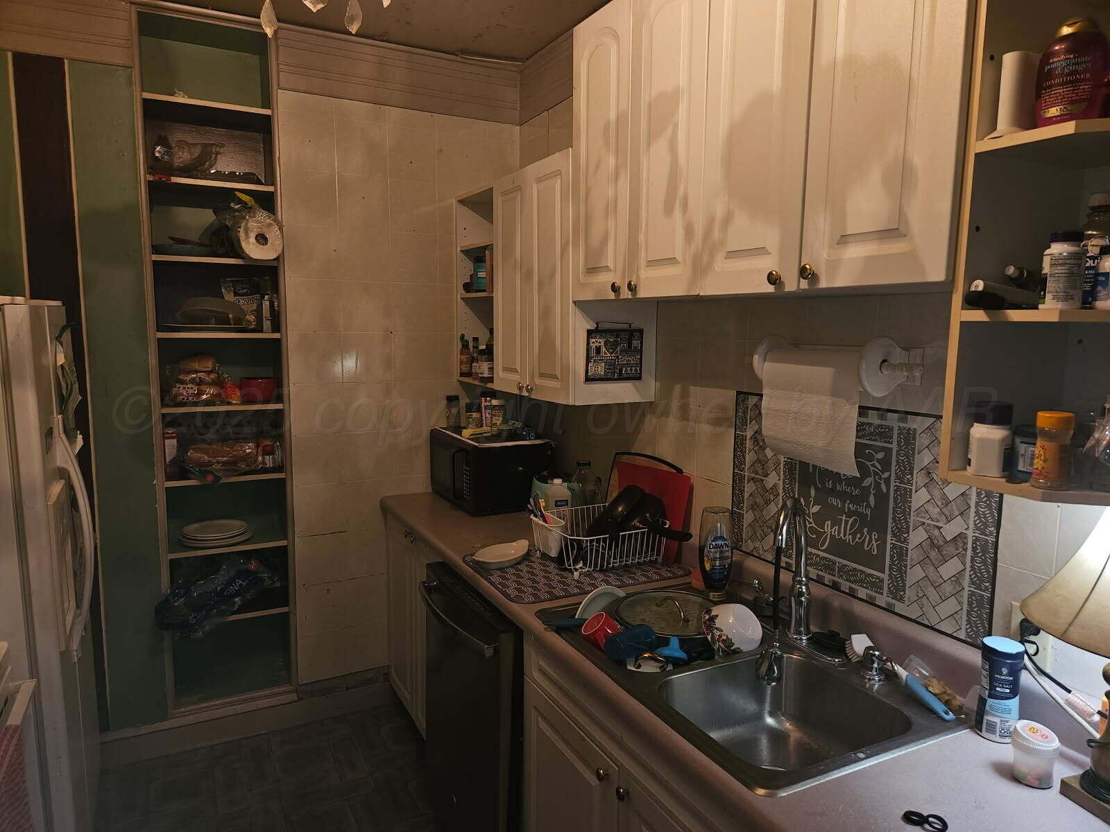 418 South Main Street Borger, TX 79007 - Photo 16 of 41 a kitchen with a sink and cabinets