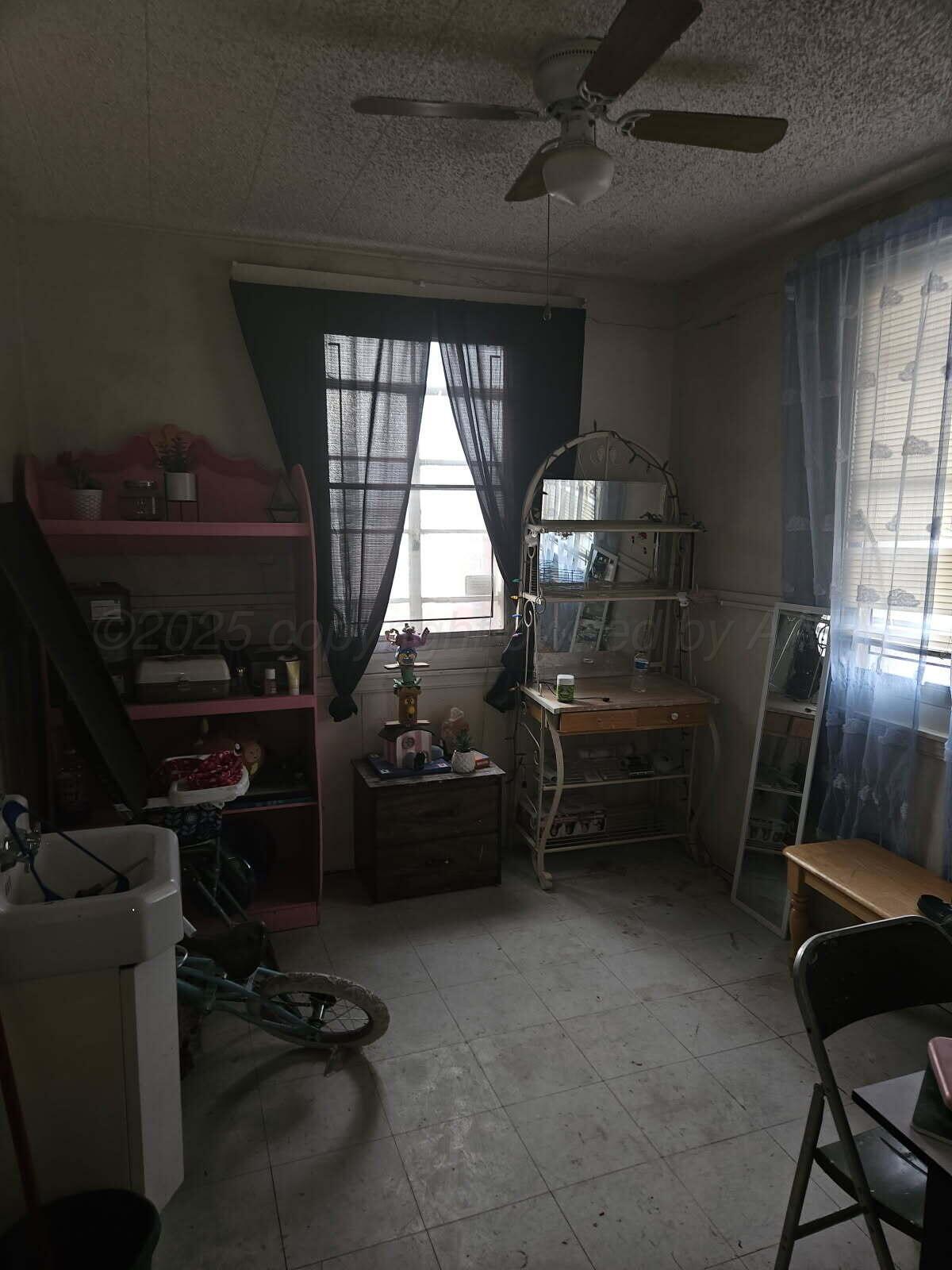 418 South Main Street Borger, TX 79007 - Photo 20 of 41 a room with furniture and a window