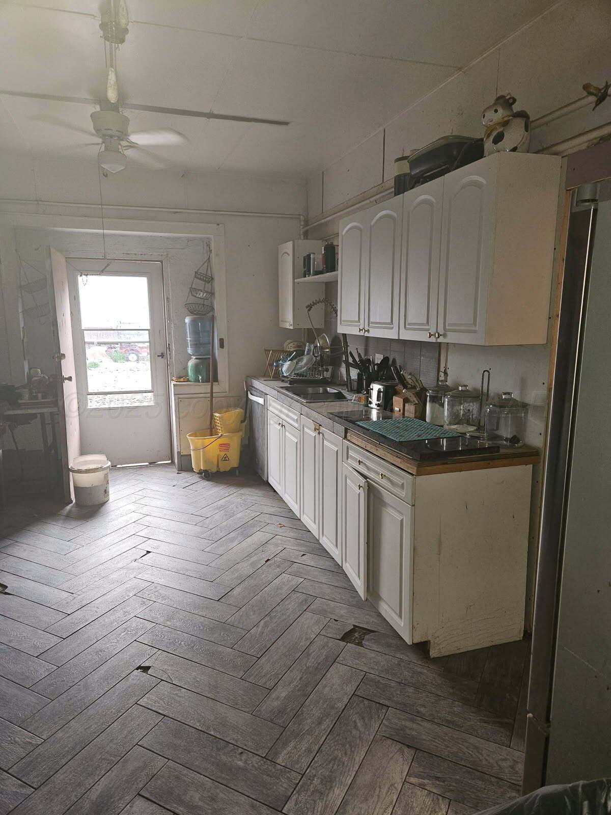 418 South Main Street Borger, TX 79007 - Photo 33 of 41 a kitchen with a sink and cabinets