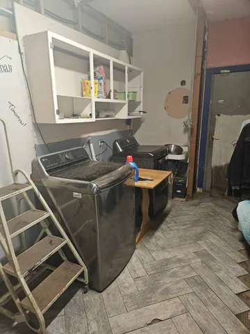 a bathroom with a window and a shower