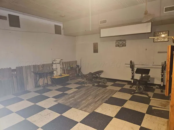 a view of a workspace with furniture