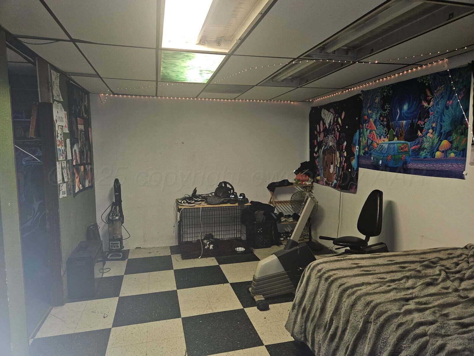 418 South Main Street Borger, TX 79007 - Photo 8 of 41 a bedroom with a bed and wooden floor