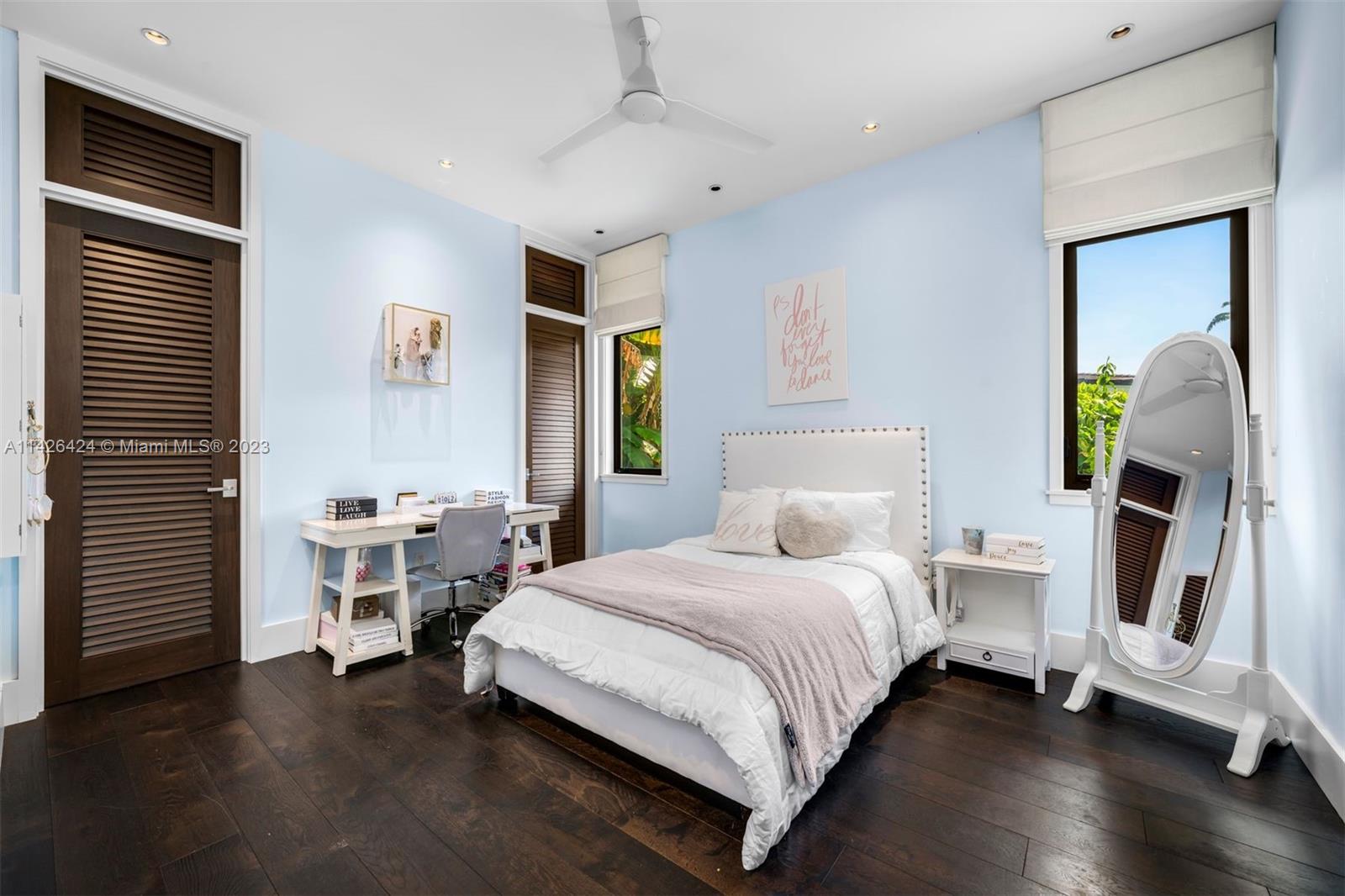 8601 Ponce De Leon Road Miami, FL 33143 - Photo 14 of 39 a bedroom with a bed and a window