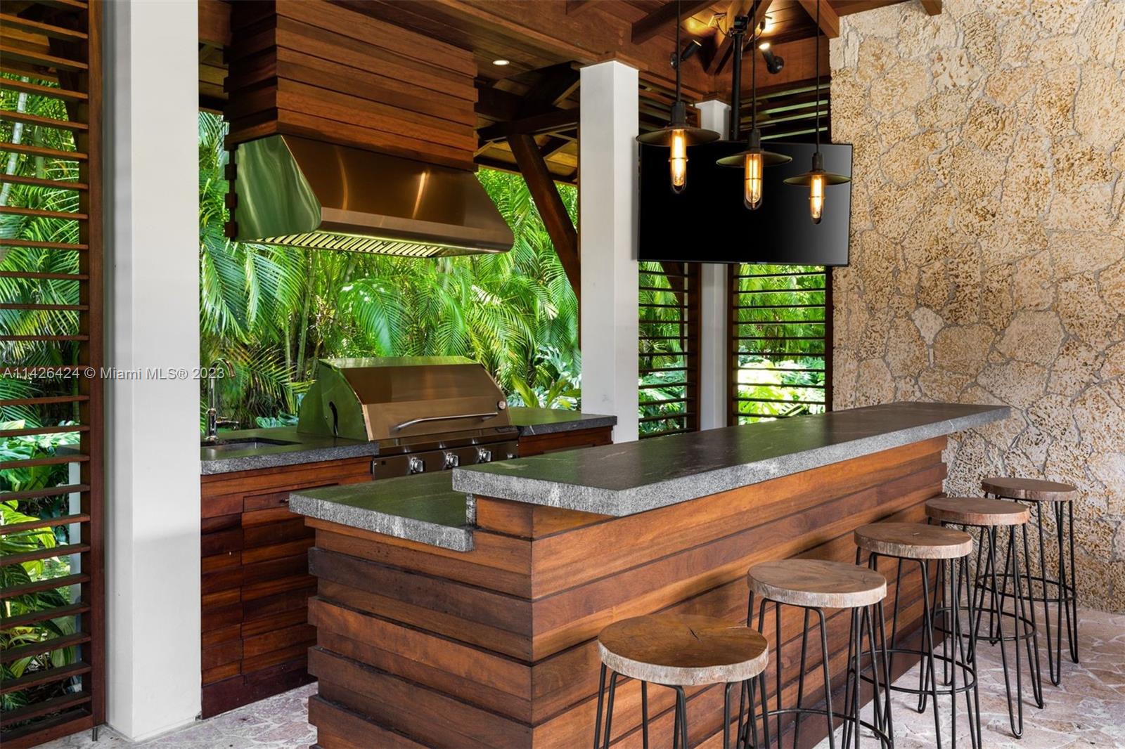 8601 Ponce De Leon Road Miami, FL 33143 - Photo 18 of 39 a view of an outdoor sitting area with brick walls