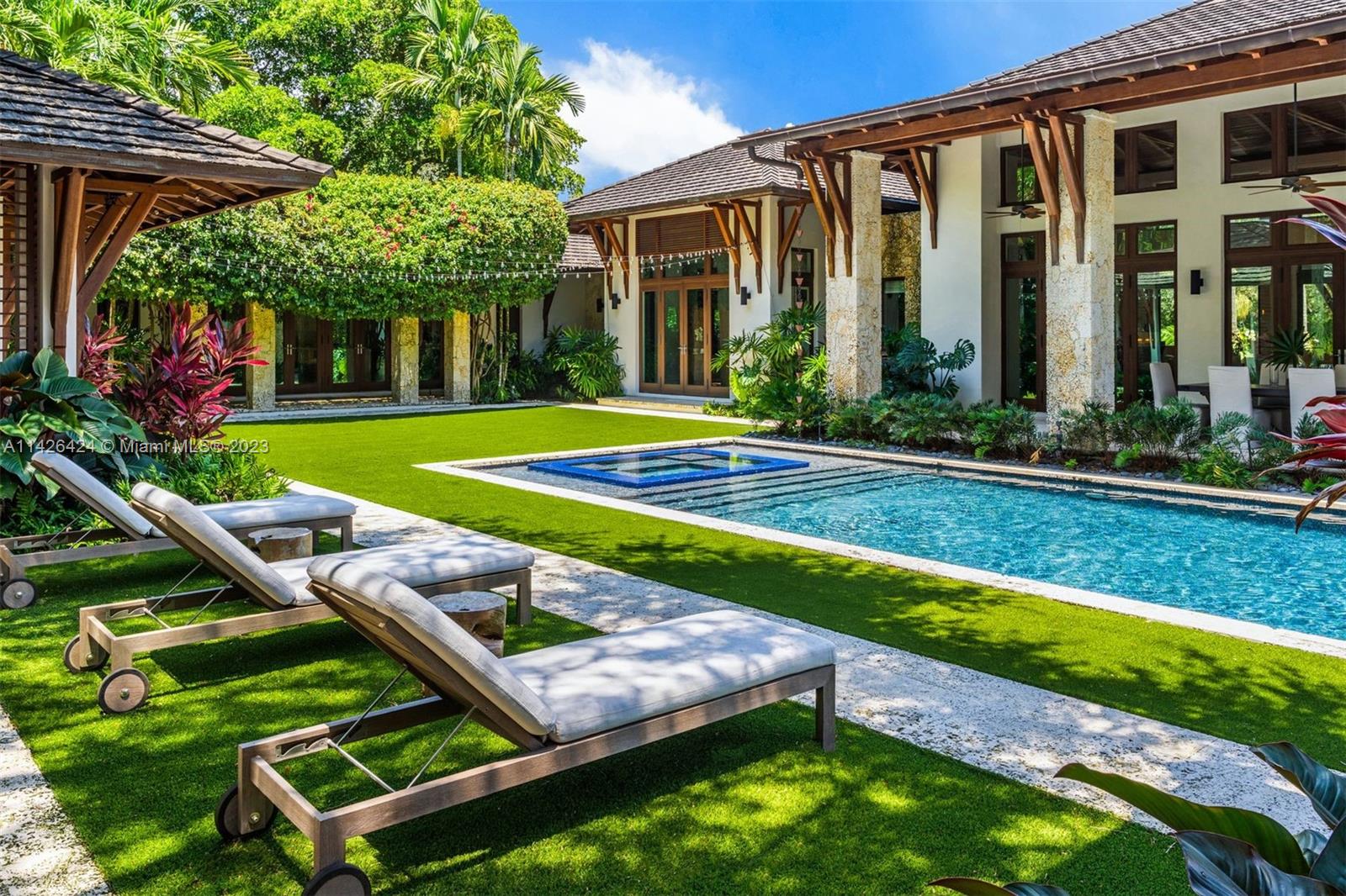 8601 Ponce De Leon Road Miami, FL 33143 - Photo 21 of 39 a view of a house with backyard porch and sitting area