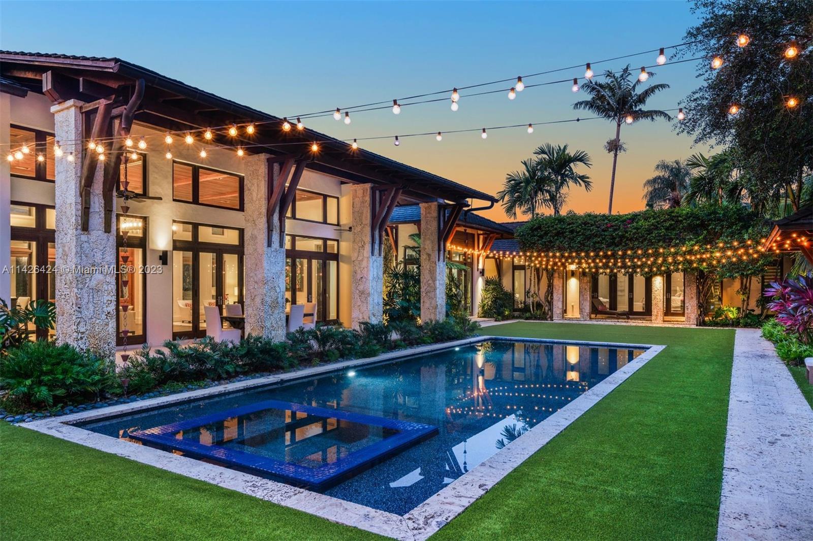 8601 Ponce De Leon Road Miami, FL 33143 - Photo 25 of 39 a view of swimming pool with a table and chairs