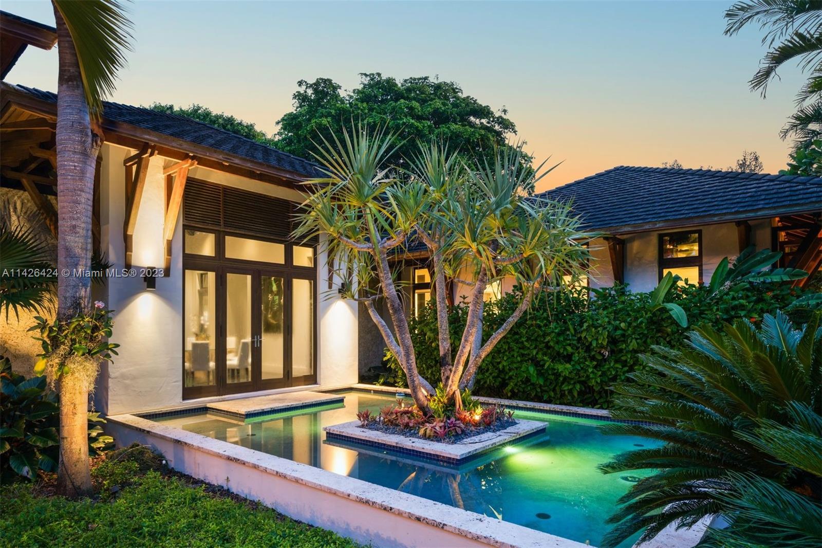 8601 Ponce De Leon Road Miami, FL 33143 - Photo 26 of 39 a view of house with swimming pool and porch