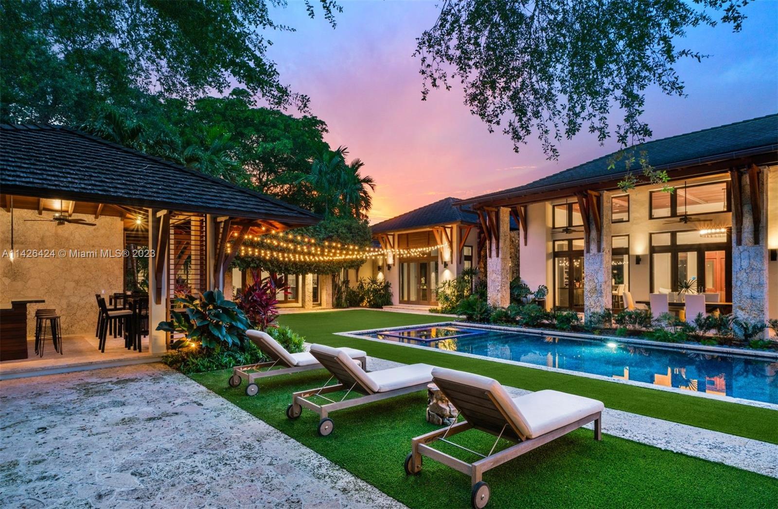 8601 Ponce De Leon Road Miami, FL 33143 - Photo 27 of 39 a swimming pool with outdoor seating and yard