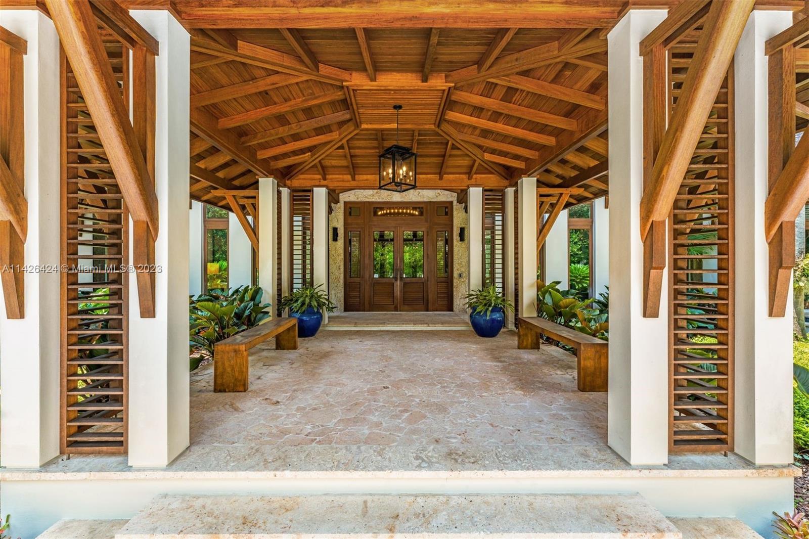 8601 Ponce De Leon Road Miami, FL 33143 - Photo 29 of 39 a front view of a building with a porch