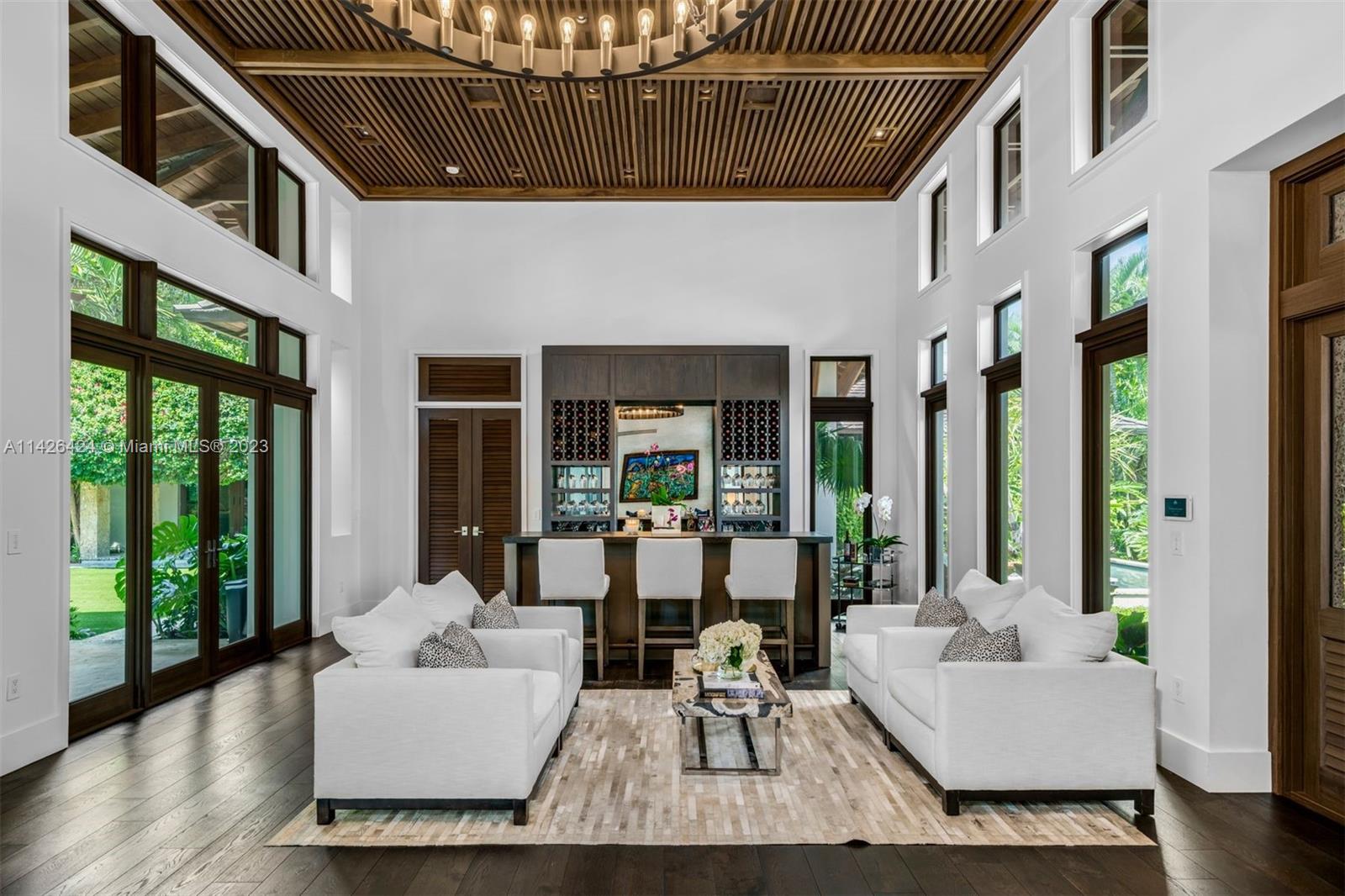 8601 Ponce De Leon Road Miami, FL 33143 - Photo 30 of 39 a living room with furniture and large windows