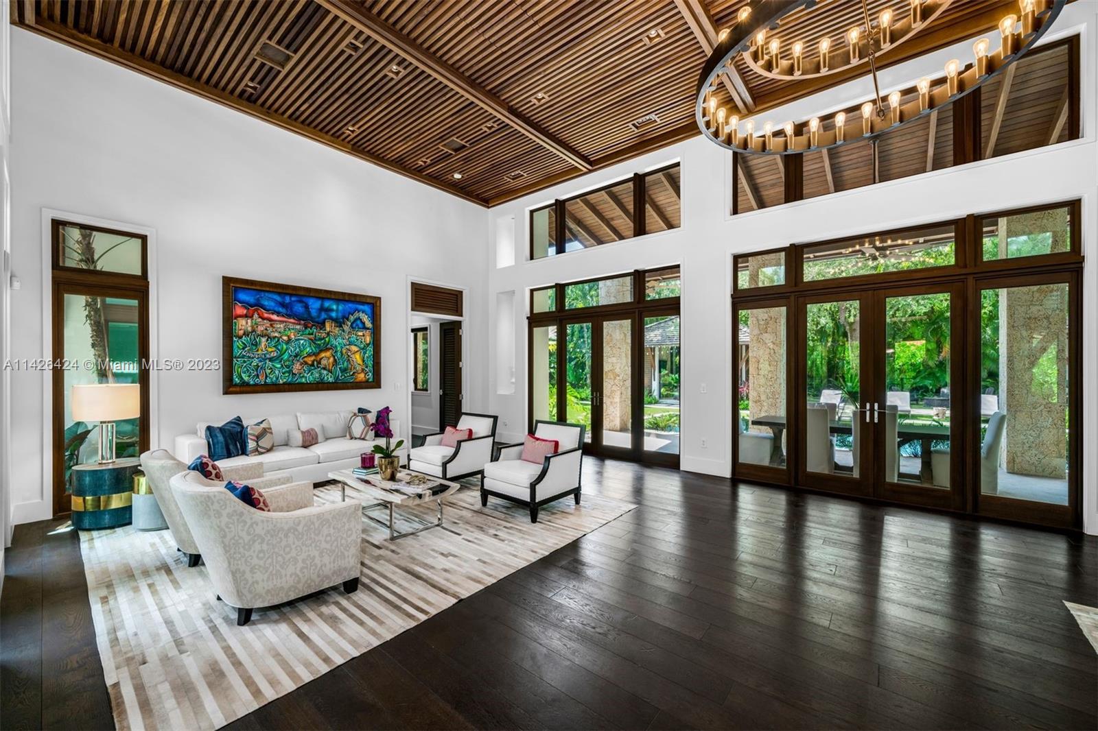 8601 Ponce De Leon Road Miami, FL 33143 - Photo 3 of 39 a living room with furniture wooden floor and a large window