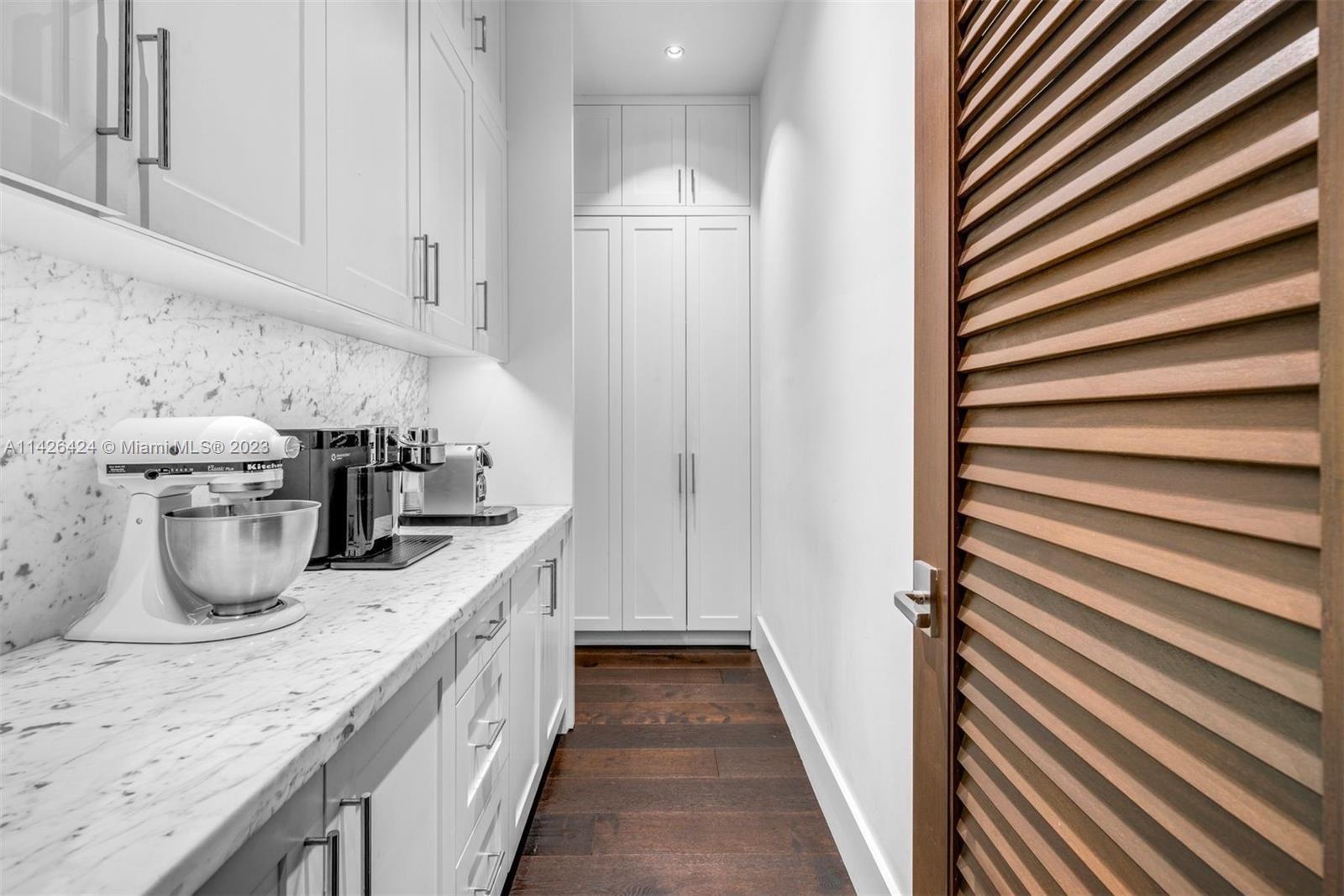 8601 Ponce De Leon Road Miami, FL 33143 - Photo 32 of 39 a kitchen with sink and refrigerator