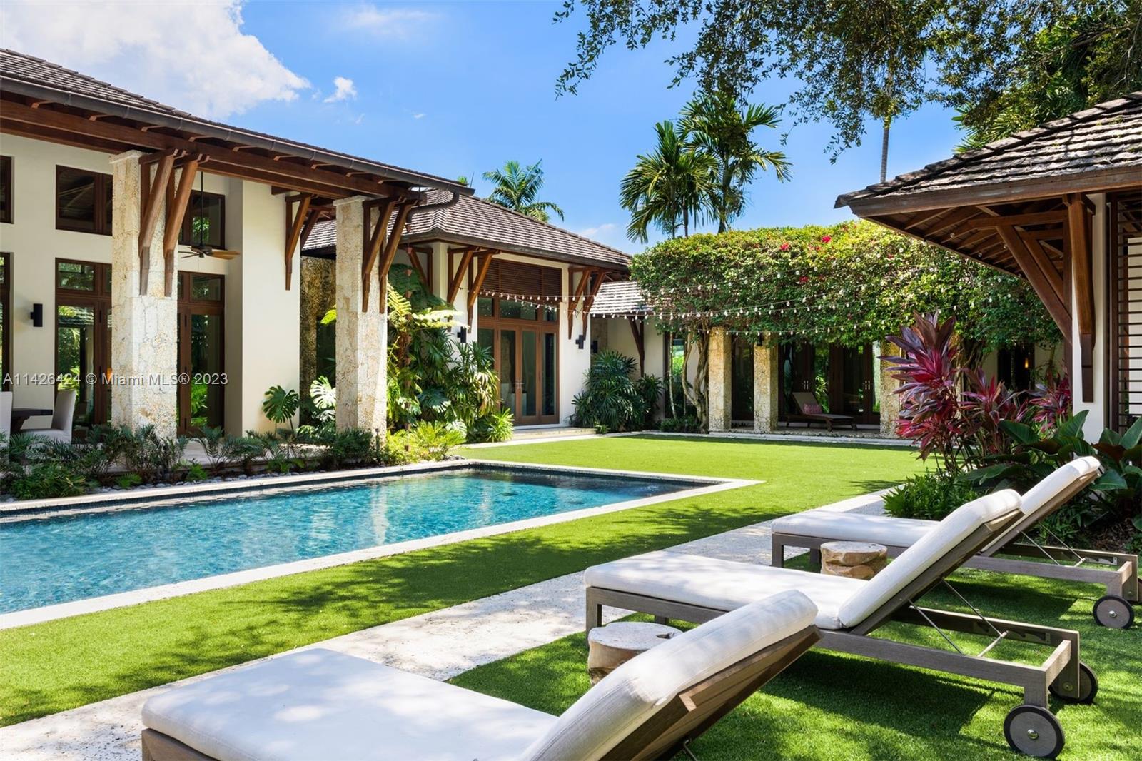 8601 Ponce De Leon Road Miami, FL 33143 - Photo 34 of 39 a view of a house with pool porch and chairs