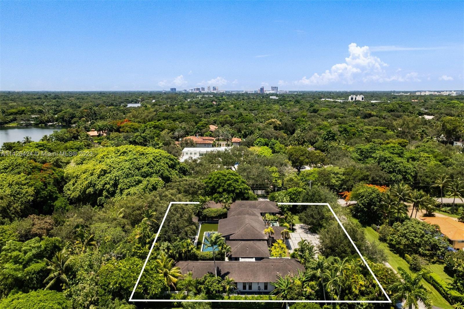 8601 Ponce De Leon Road Miami, FL 33143 - Photo 39 of 39 an aerial view of a houses with a yard
