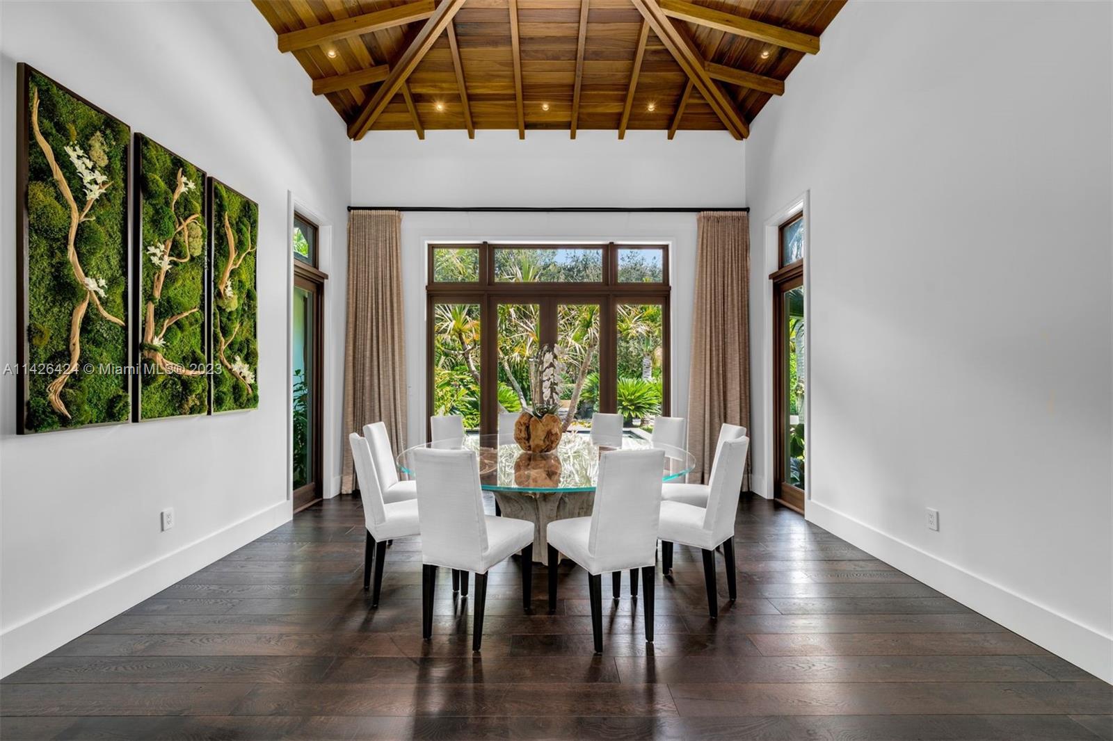 8601 Ponce De Leon Road Miami, FL 33143 - Photo 6 of 39 a view of a dining room with furniture window and wooden floor