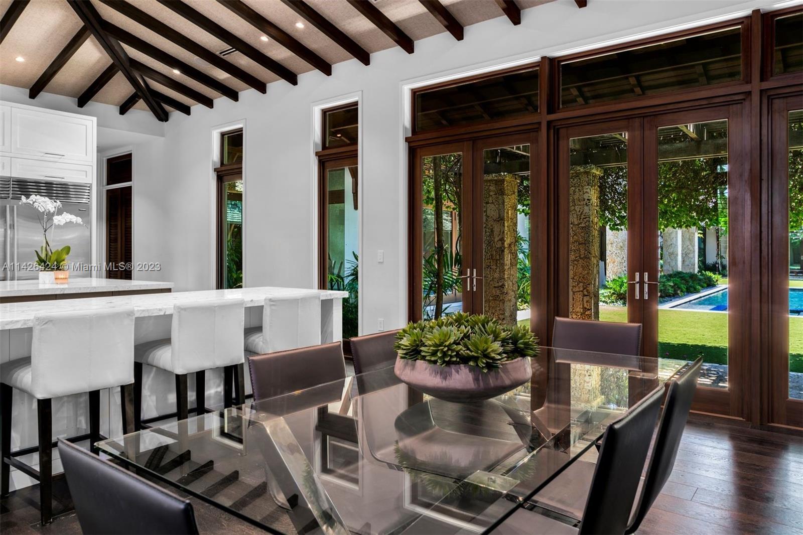 8601 Ponce De Leon Road Miami, FL 33143 - Photo 10 of 39 a view of an outdoor dining space with furniture