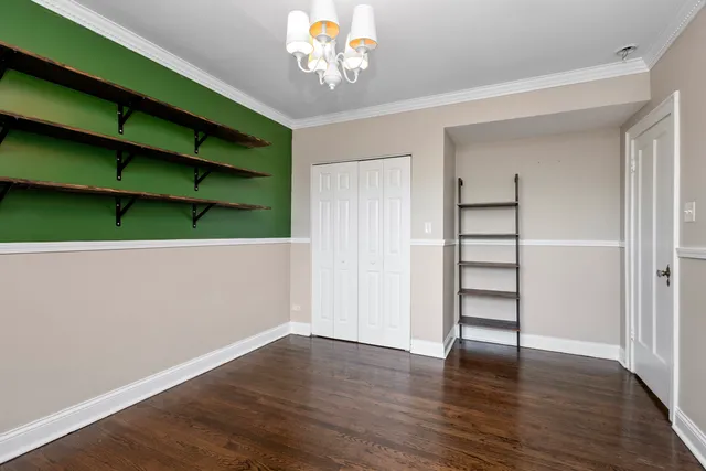 a view of room with window and wooden floor