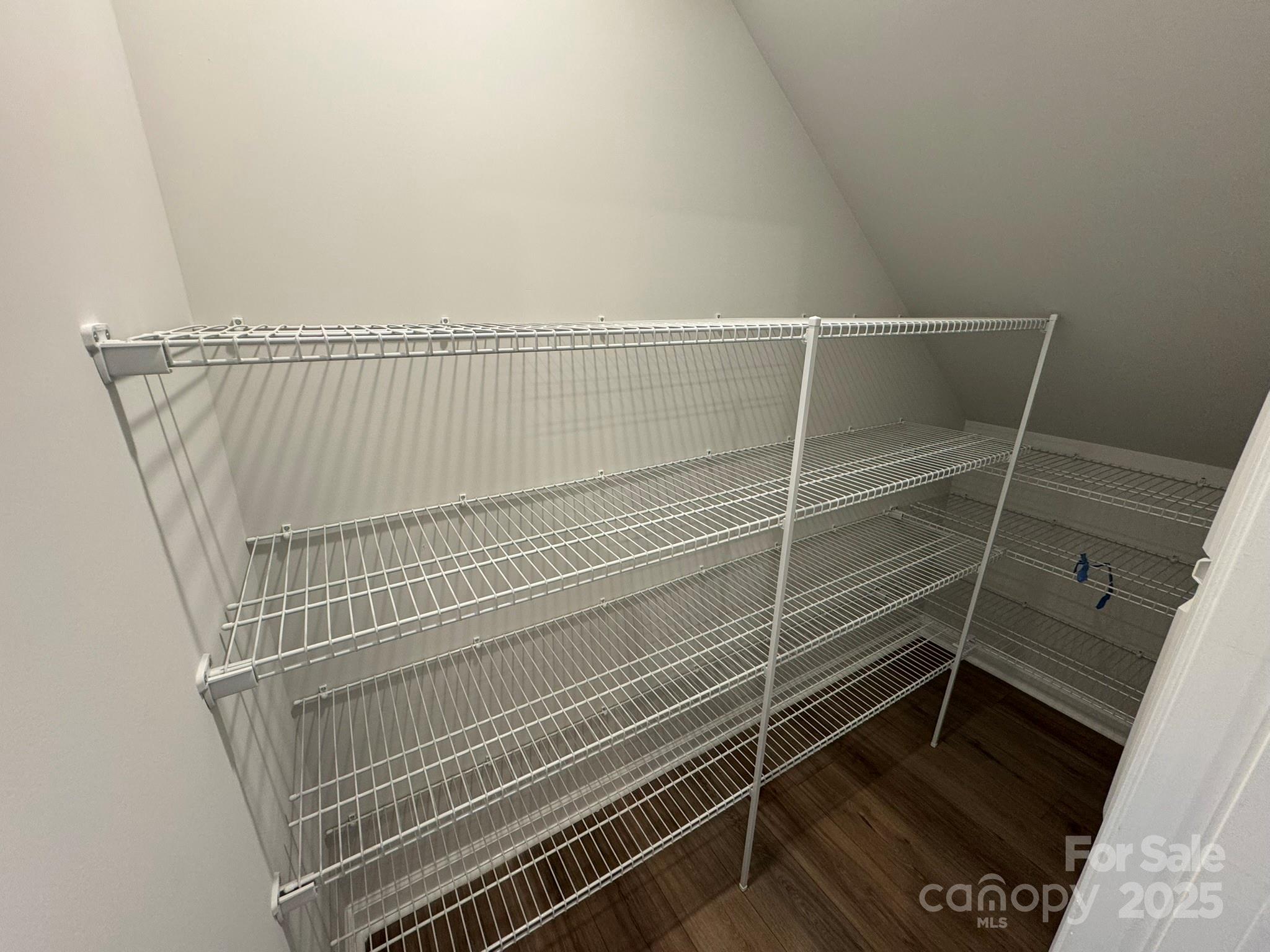 4750 Lakeview Road, Unit 18 Charlotte, NC 28216 - Photo 23 of 46 a view of utility room with wooden floor and door