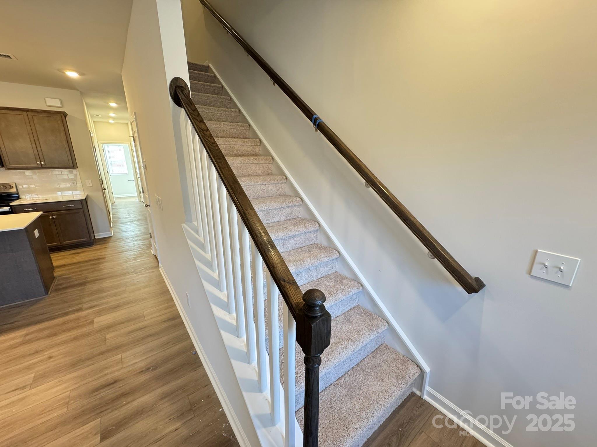 4750 Lakeview Road, Unit 18 Charlotte, NC 28216 - Photo 28 of 46 a view of a hallway with wooden floor and staircase