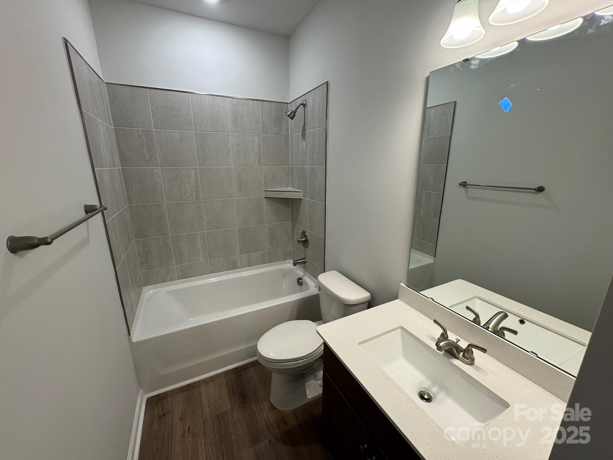 4750 Lakeview Road, Unit 18 Charlotte, NC 28216 - Photo 32 of 46 a bathroom with a sink toilet and shower