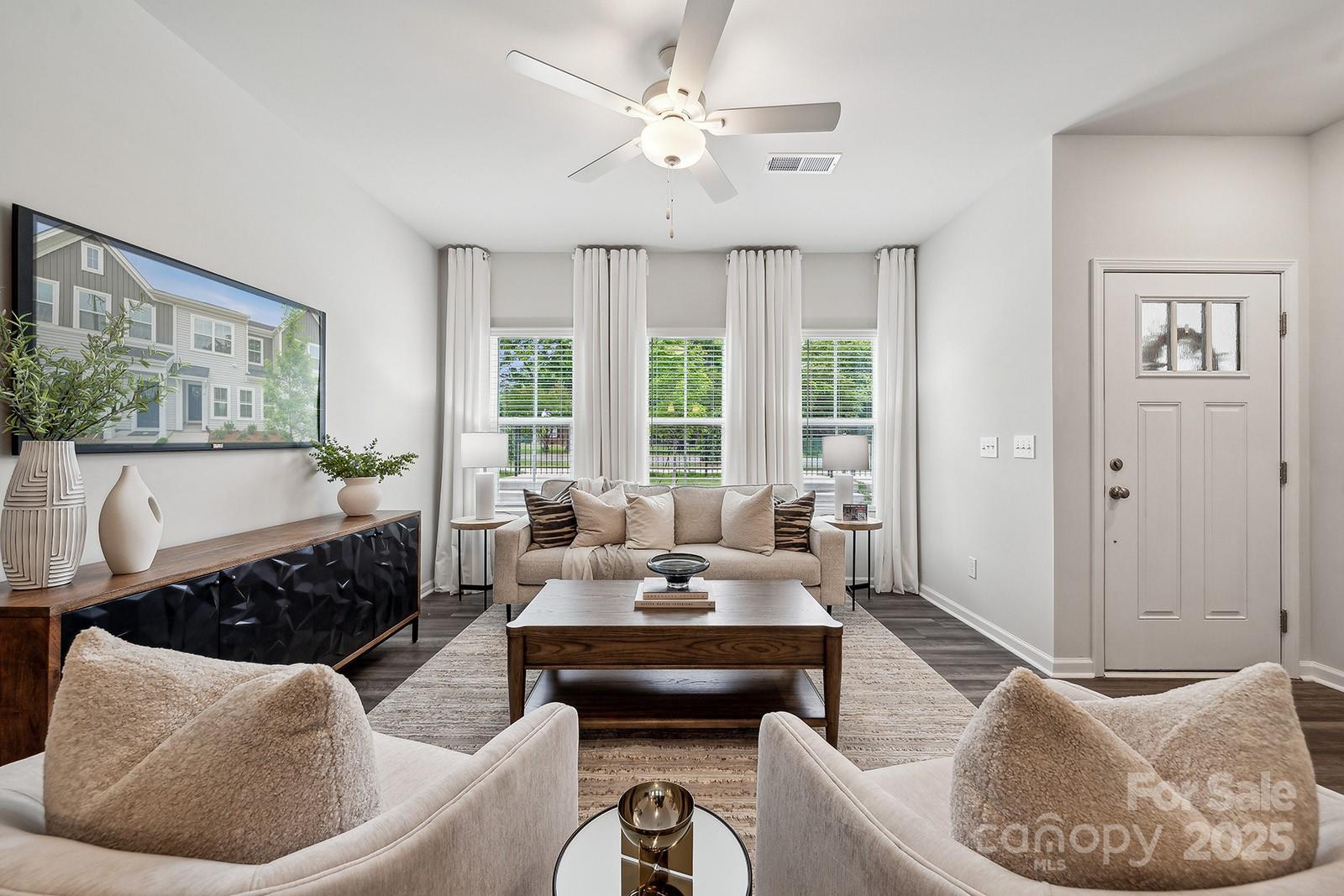 4750 Lakeview Road, Unit 18 Charlotte, NC 28216 - Photo 4 of 46 a living room with furniture and a large window