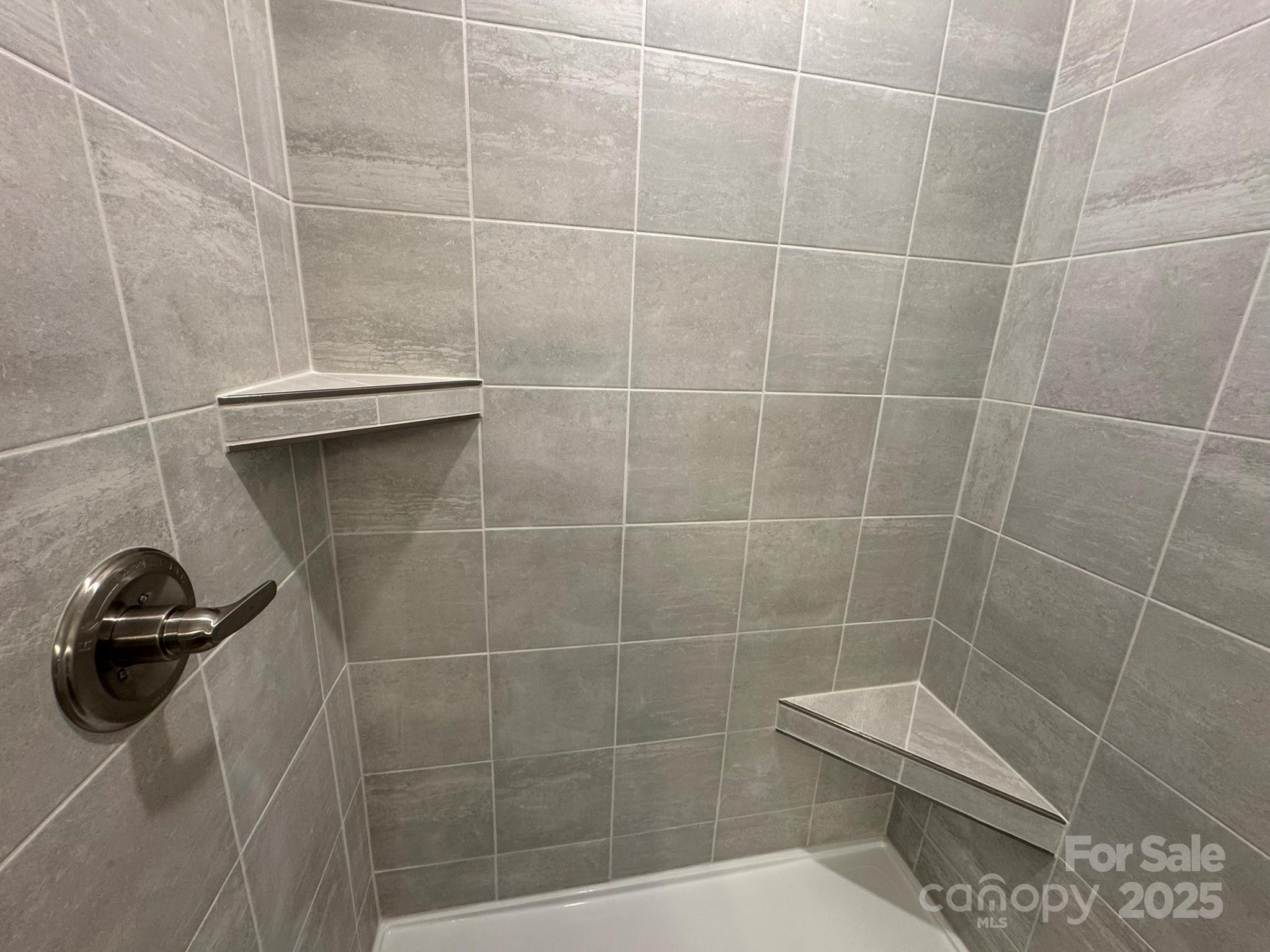4750 Lakeview Road, Unit 18 Charlotte, NC 28216 - Photo 44 of 46 a bathroom with a shower