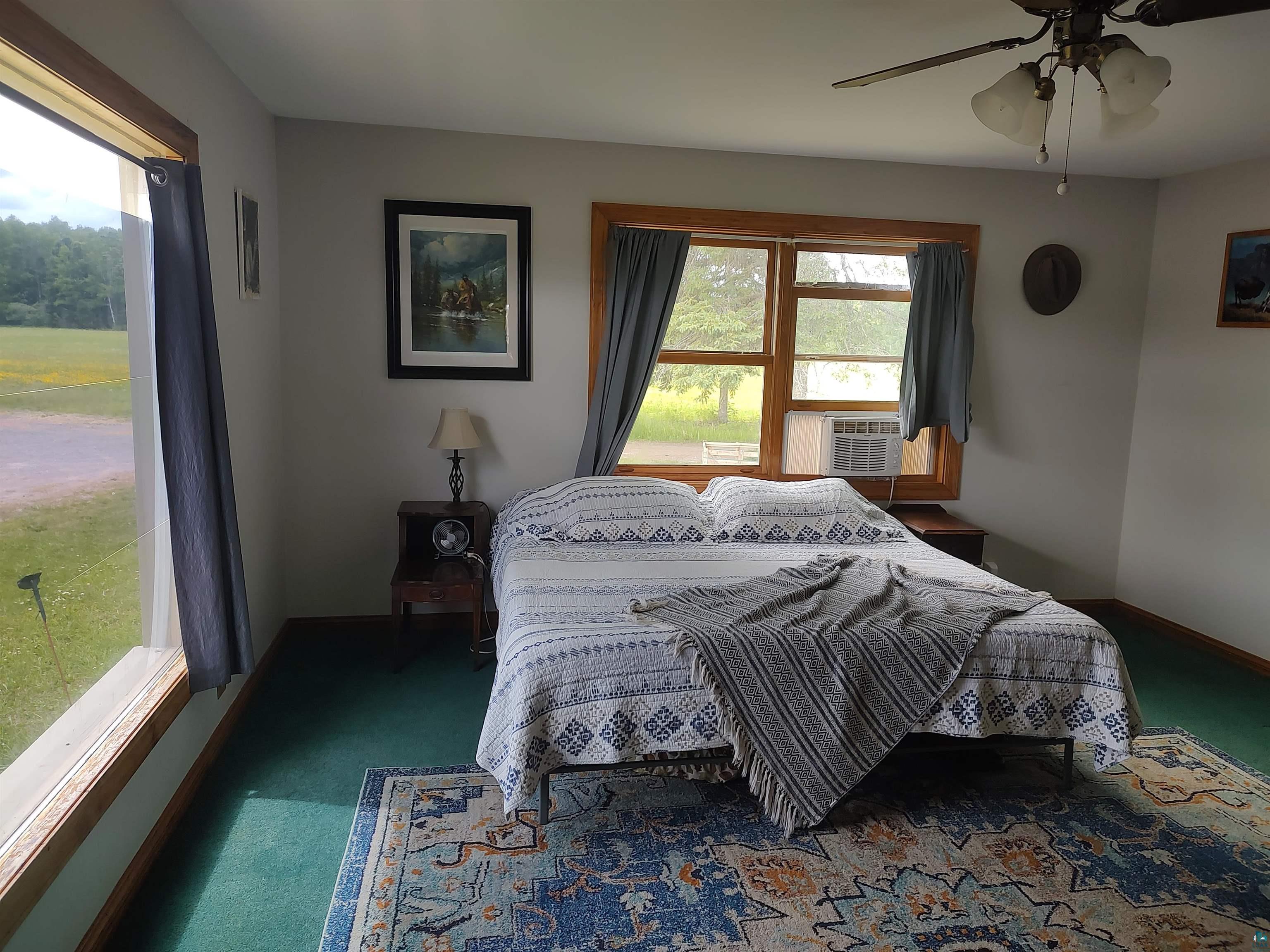 2585 Hautala Road Iron River, WI 54847 - Photo 17 of 28 Room featuring light-toned walls and wood-trimmed windows