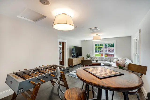 a bathroom with a granite countertop bathtub shower sink and mirror