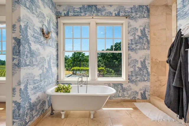 a bathroom with a granite countertop sink mirror and