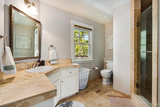 a bathroom with a sink and a window