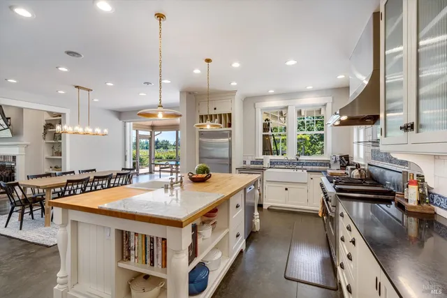 a dining room with a table and chairs
