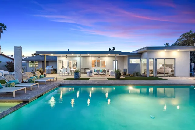 a view of a swimming pool with a patio