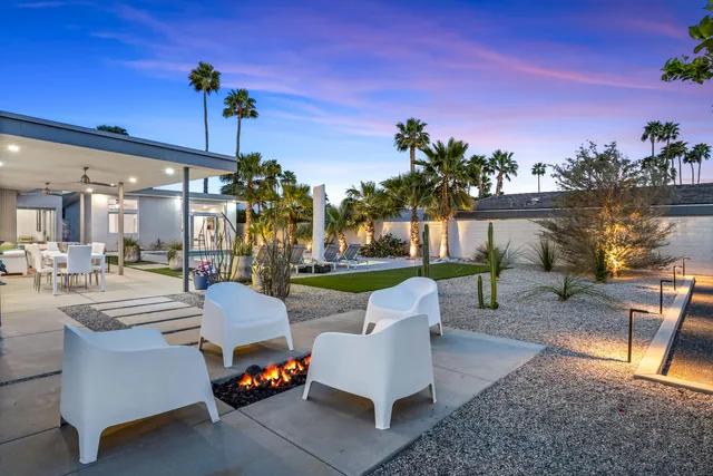 a front view of a house with garden and porch