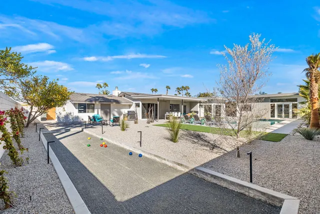 a kitchen with stainless steel appliances granite countertop a sink and a window