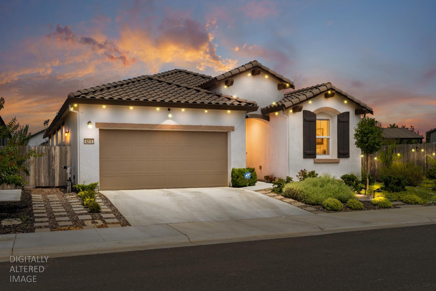 4216 Creede Way Rancho Cordova, CA 95742 - Photo 3 of 56 a front view of a house with a yard and garage