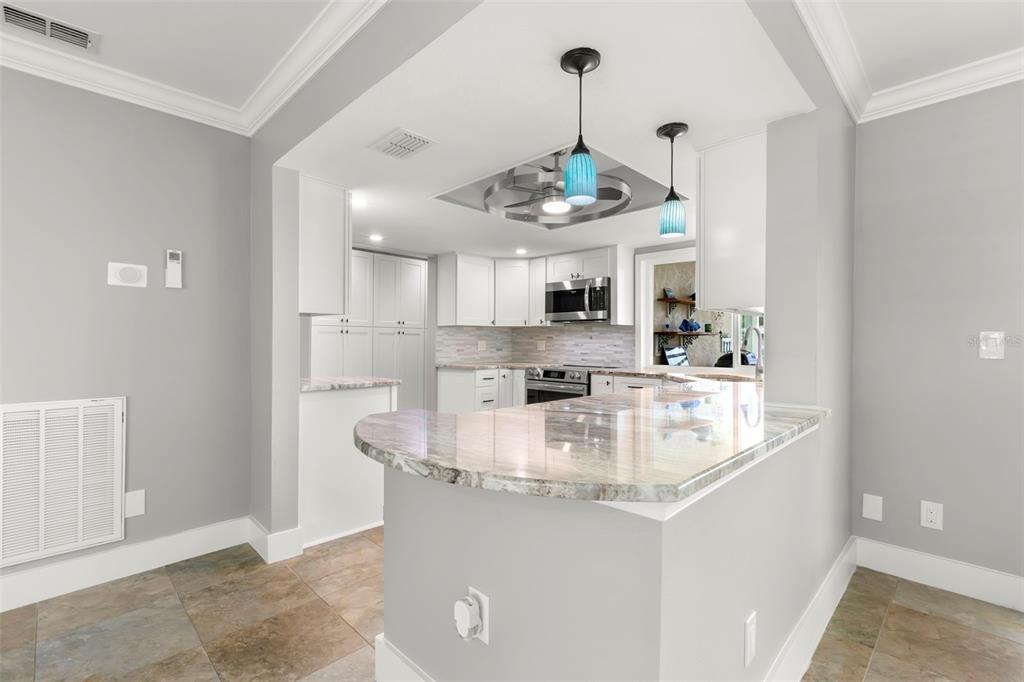 4003 Headsail Drive New Port Richey, FL 34652 - Photo 12 of 50 a view of a kitchen counter sink refrigerator and cabinets