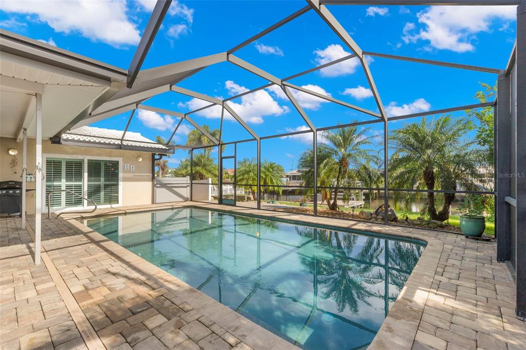 4003 Headsail Drive New Port Richey, FL 34652 - Photo 18 of 50 a view of a indoor swimming pool with a patio
