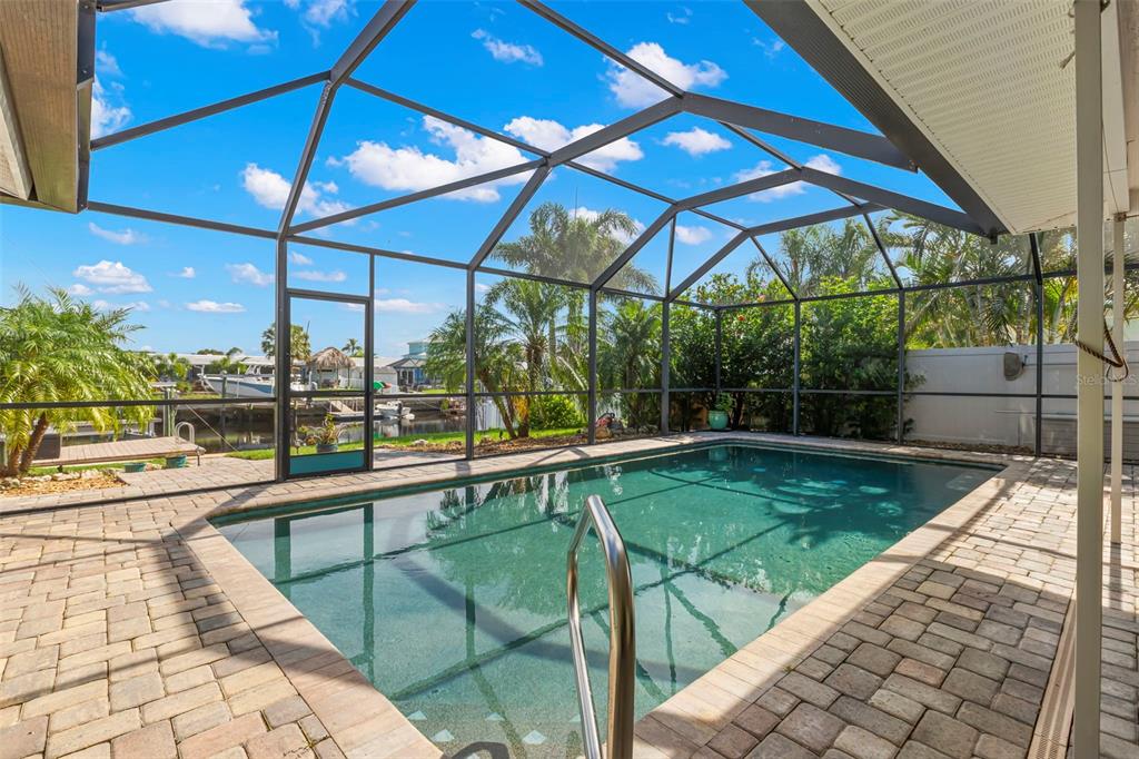 4003 Headsail Drive New Port Richey, FL 34652 - Photo 19 of 50 a view of a swimming pool with a patio